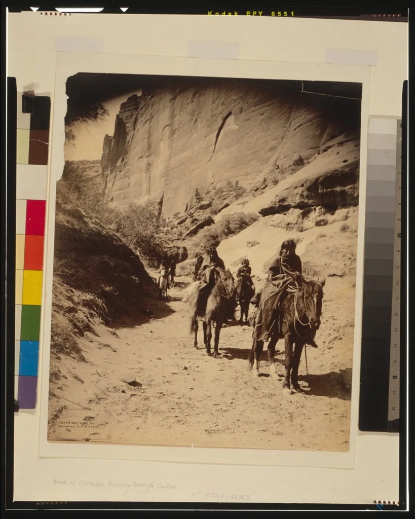 Band of mounted Navahos passing through Cañon, 1904