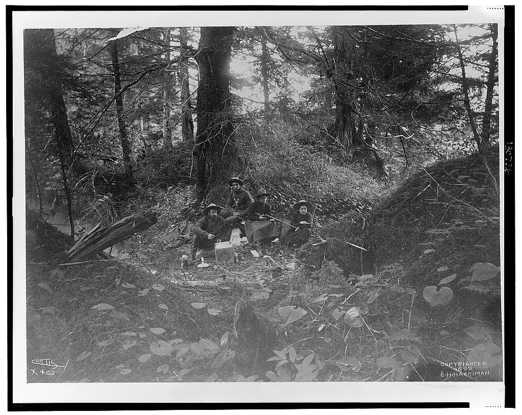 [Two men and two women seated in forest in Alaska, 1899]
