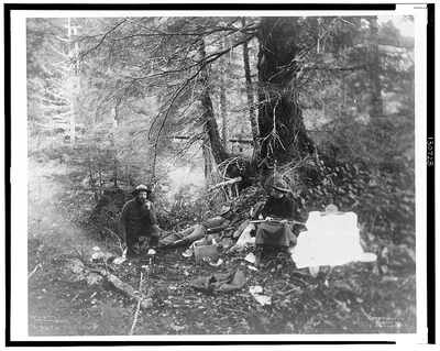 [Two men and one women in forest in Alaska, 1899]