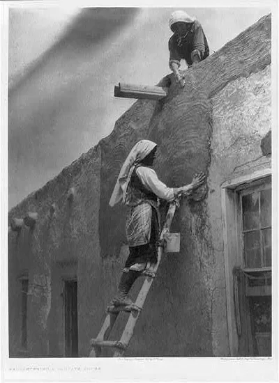 Replastering a Paguate House, 1925