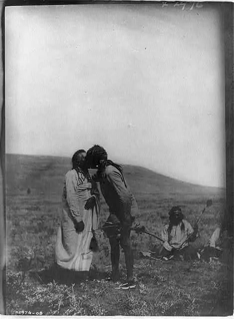 Atsina crazy dance--[A dancer kisses the grandfather], Montana, 1908