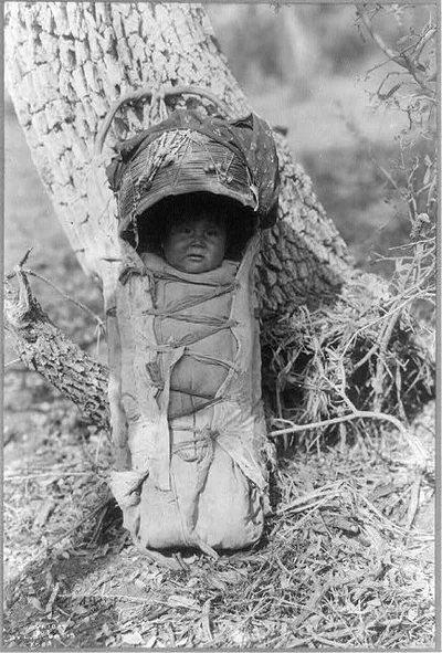 Apache babe in carrier, 1903
