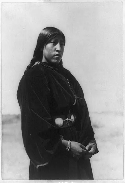 [Arapaho maiden, three-quarter-length portrait, standing, facing…, 1910