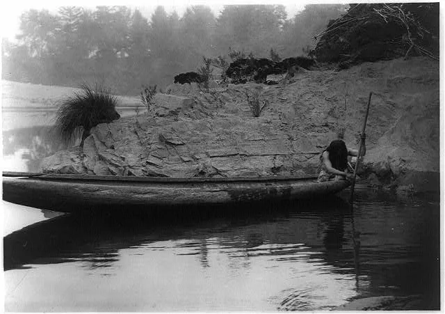 Fishing from canoe--Hupa, California, 1923