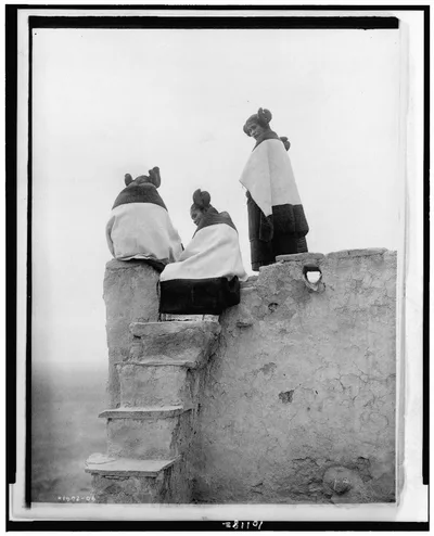 [Three Hopi women at top of adobe steps, New Mexico], 1906