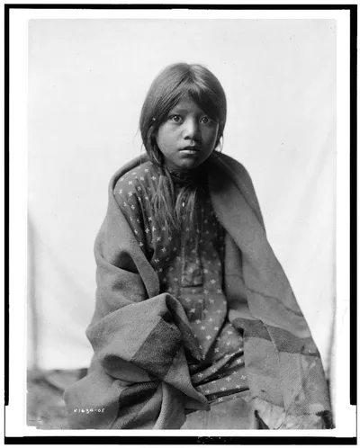 [A Taos girl, three-quarter length portrait, seated, facing front], New Mexico, 1905