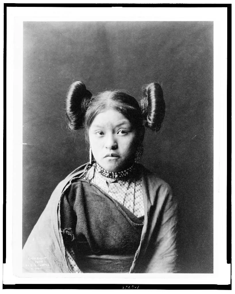 [Gobuguoy, Walpi girl, half-length portrait, facing front, hair tied…, Arizona, Walpi, 1900