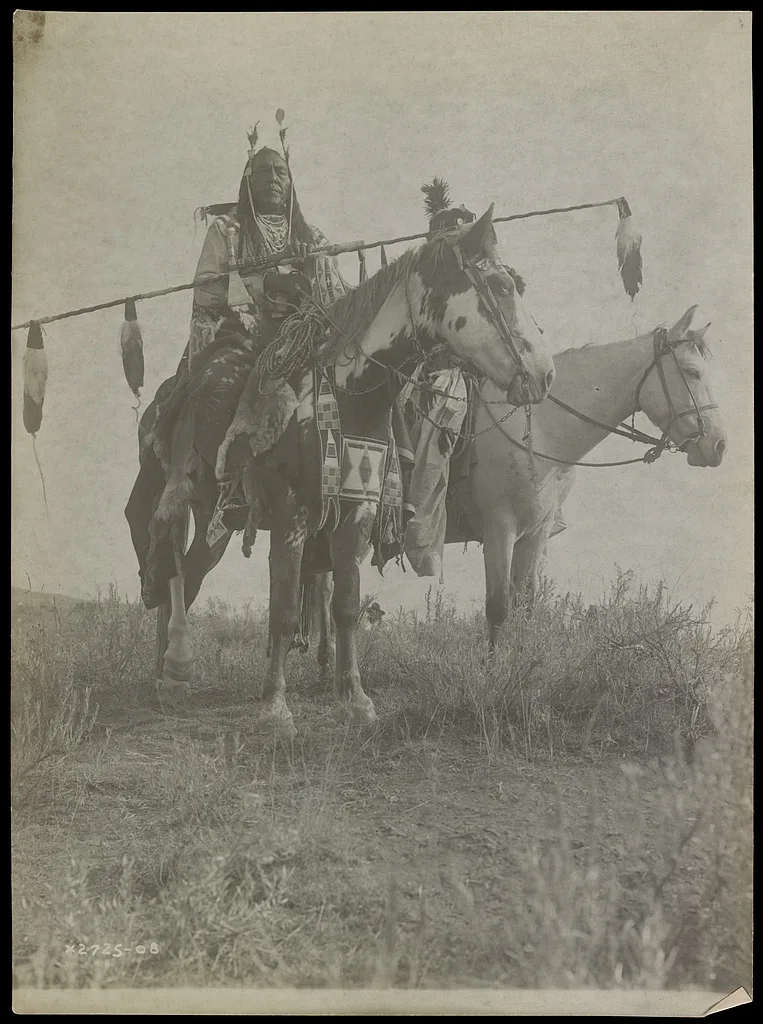 [Village criers on horseback, Bird On the Ground and Forked Iron,…, Montana, 1908