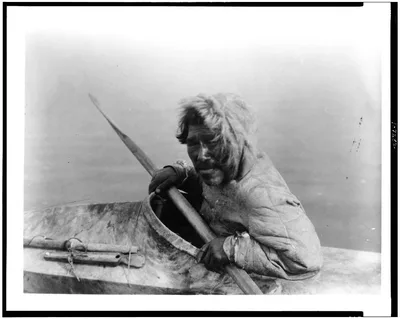 The seal-hunter, Noatak, in kayak, facing left, Noatak, Alaska, 1929