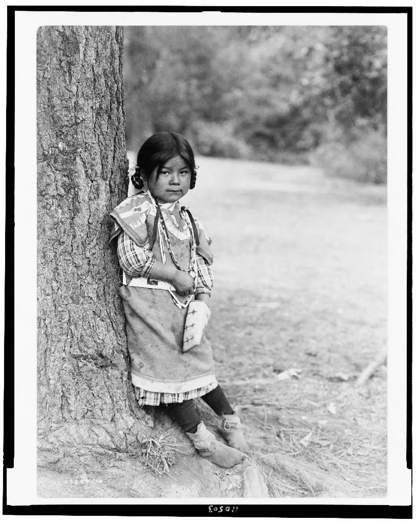 [Innocence, an Umatilla girl, full-length portrait, standing by tree,…, Oregon, 1910