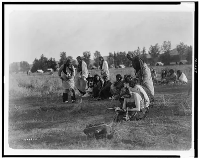 Priests passing before the pipe--Cheyenne, Montana, 1910
